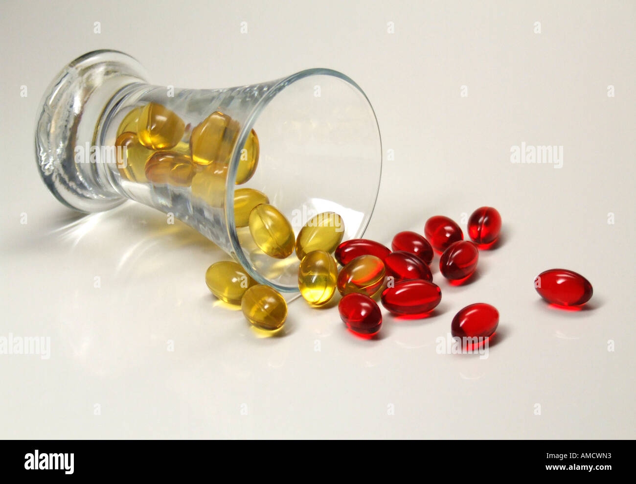Oil capsule in glass elevated view Stock Photo