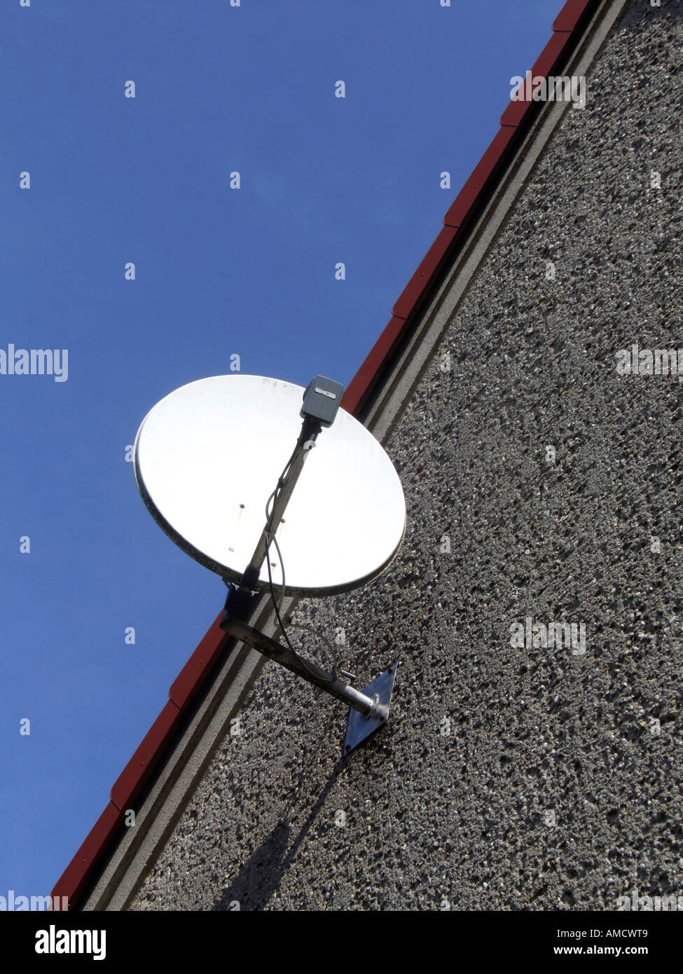 Satellite dish on roof low angle view Stock Photo