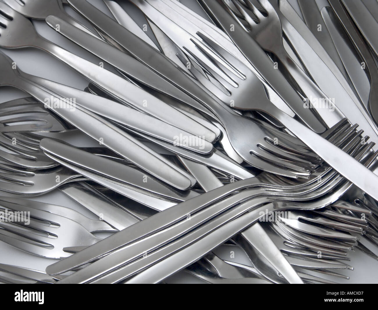 A jumble of stainless steel forks Stock Photo