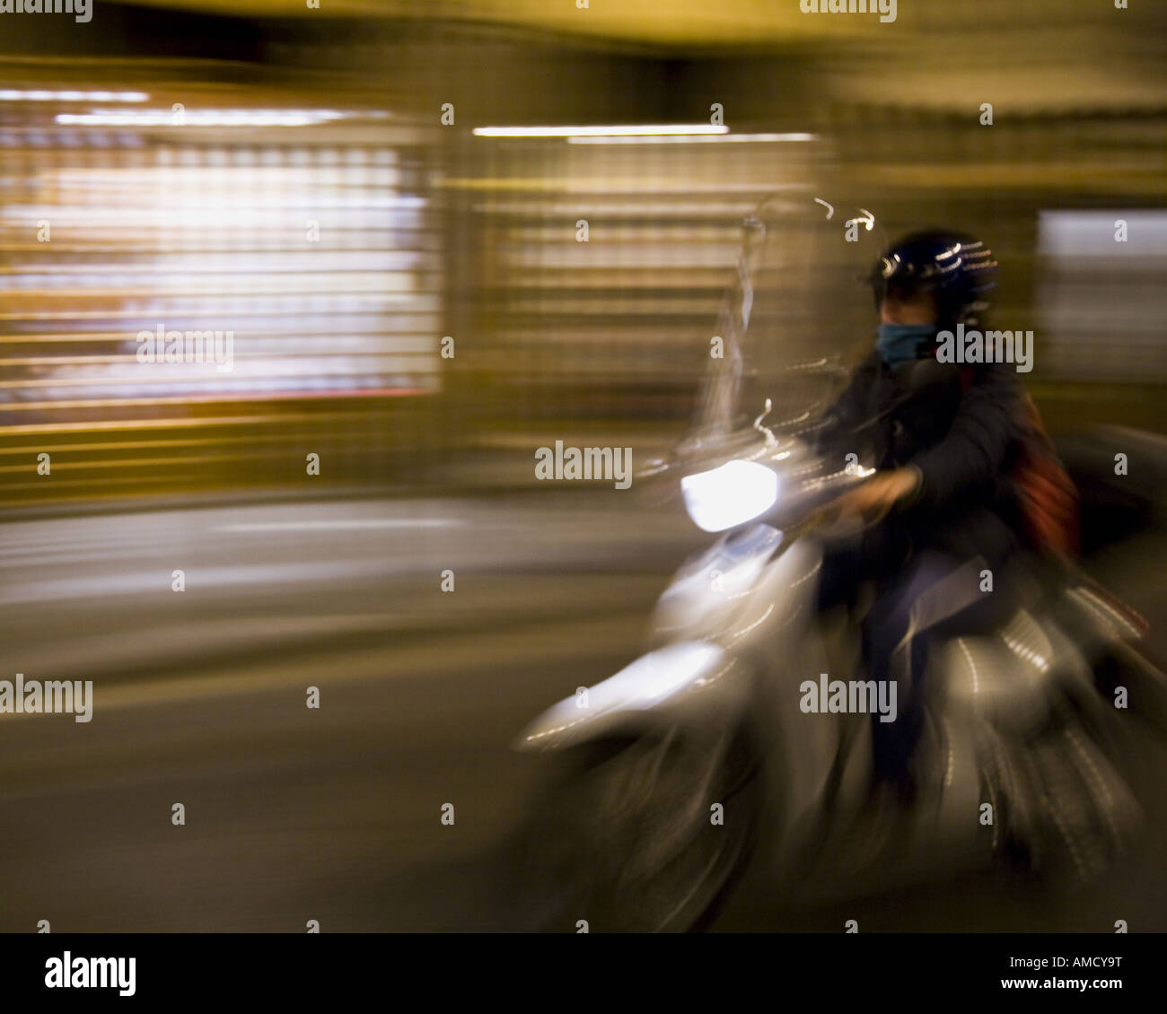 Man on motorcycle with motion blur Stock Photo - Alamy
