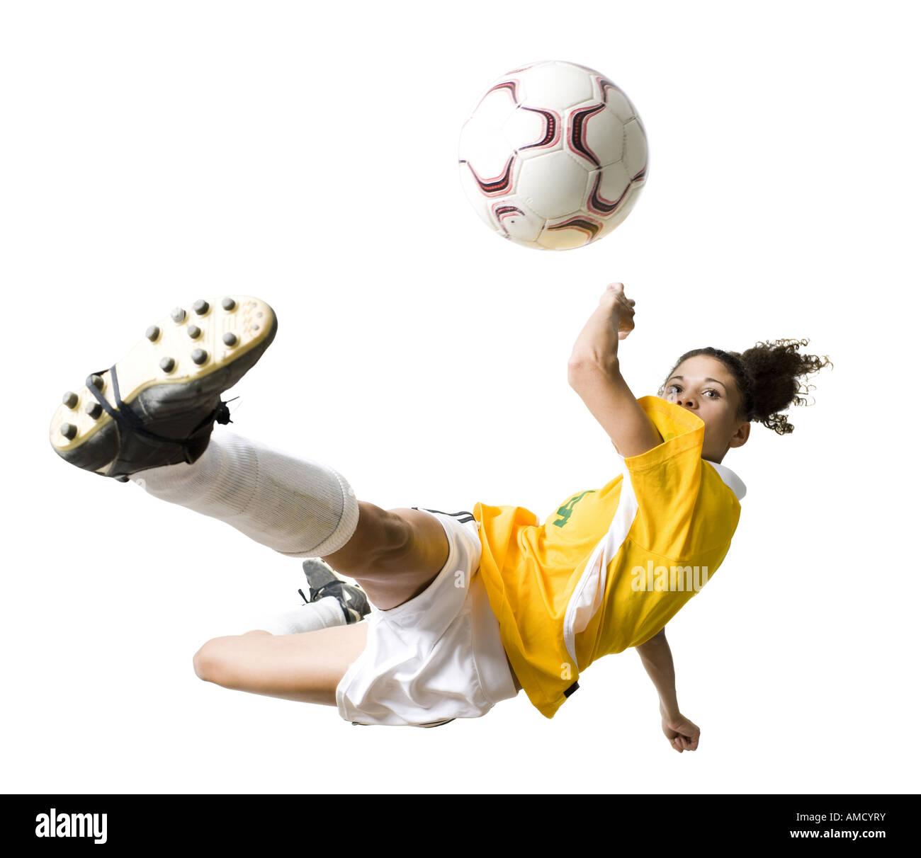 Teenage girl kicking soccer ball Stock Photo Alamy