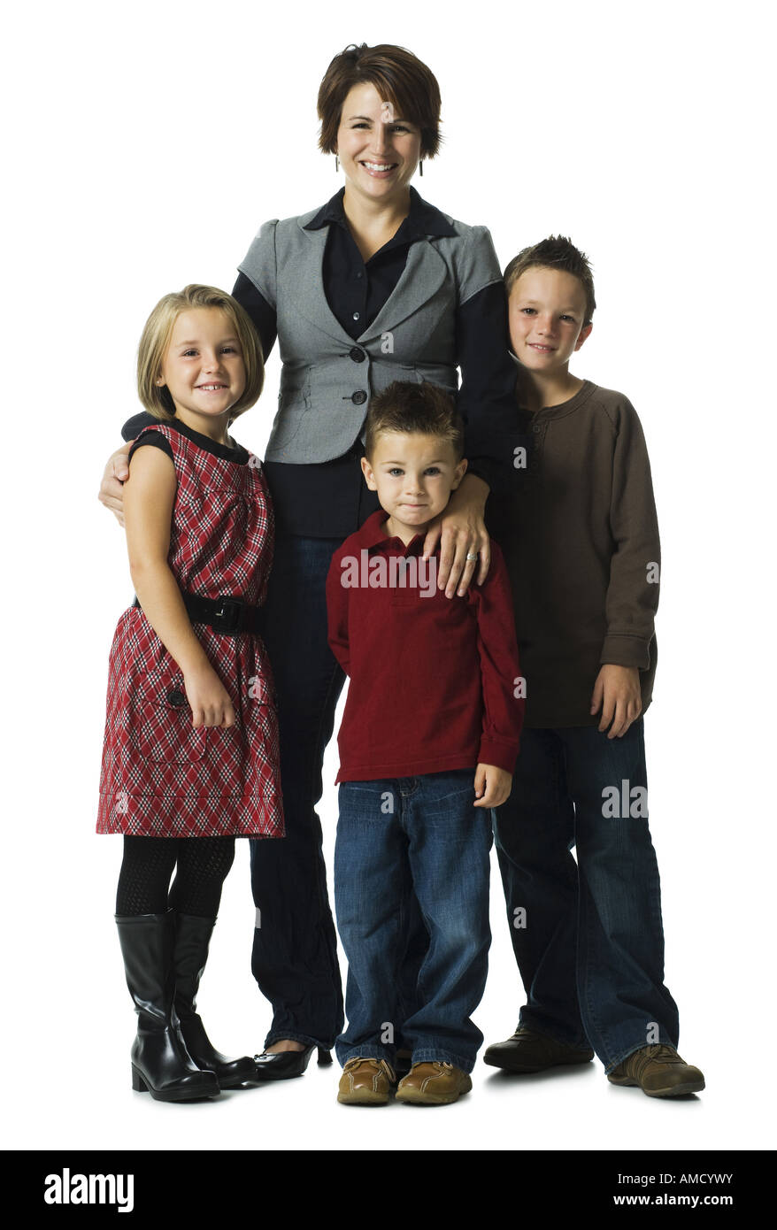 Woman with three children smiling Stock Photo