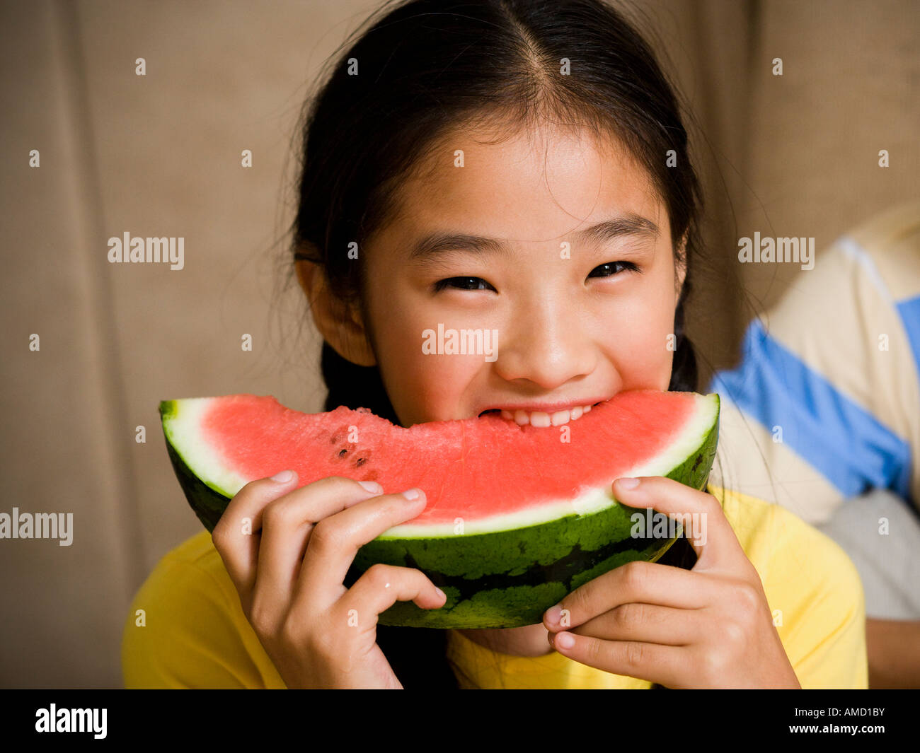 Closeup of girl eating watermelon Stock Photo. 
