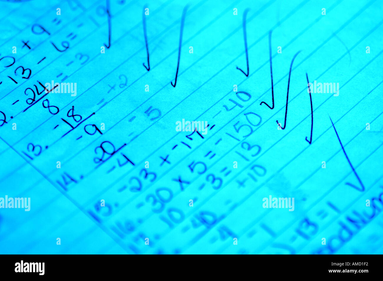 Light blue lined paper writing big check marks Stock Photo Alamy