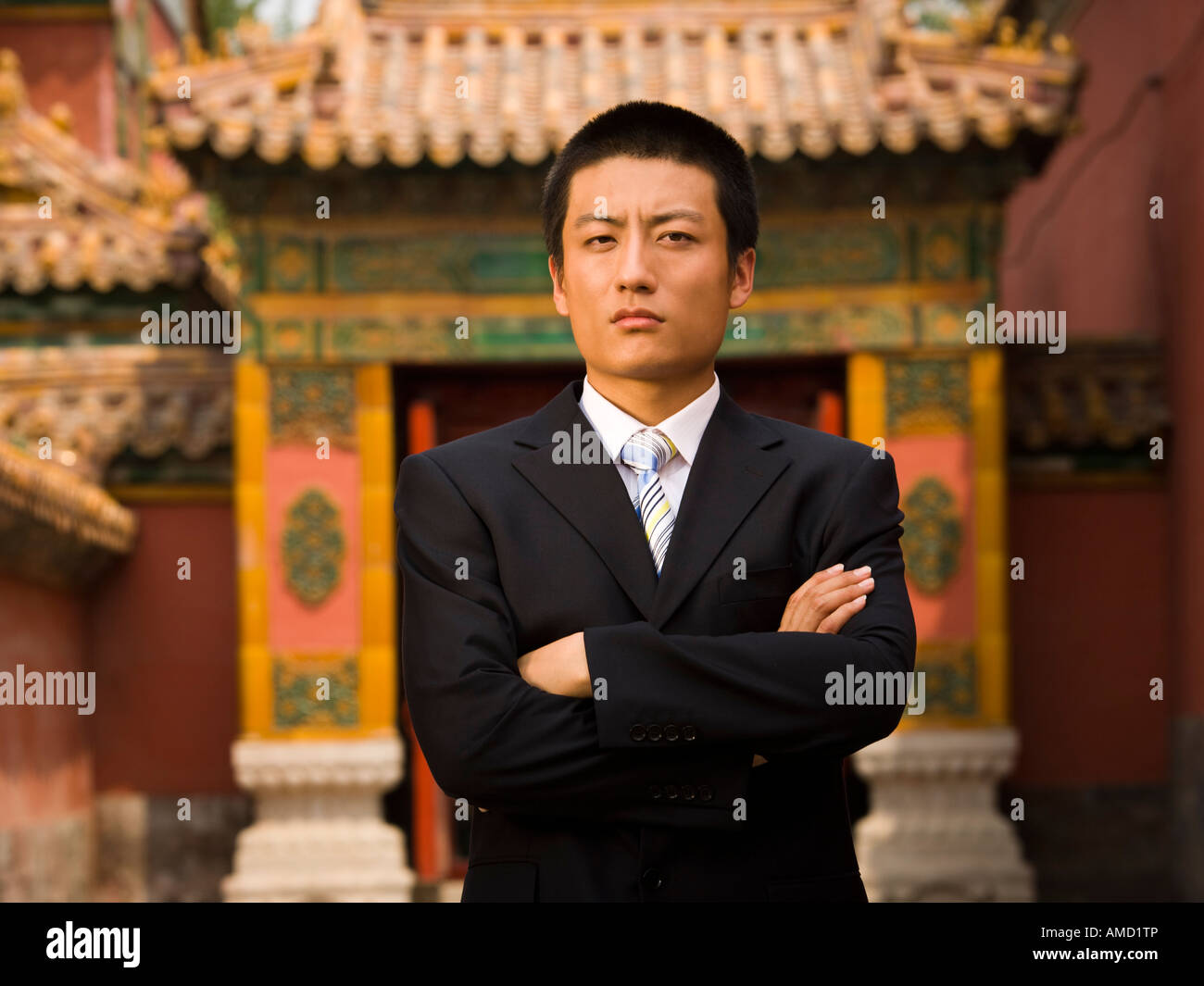 Portrait of a businessman with arms crossed outdoors Stock Photo - Alamy