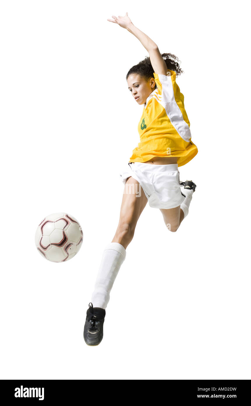 Teenage girl kicking soccer ball Stock Photo Alamy