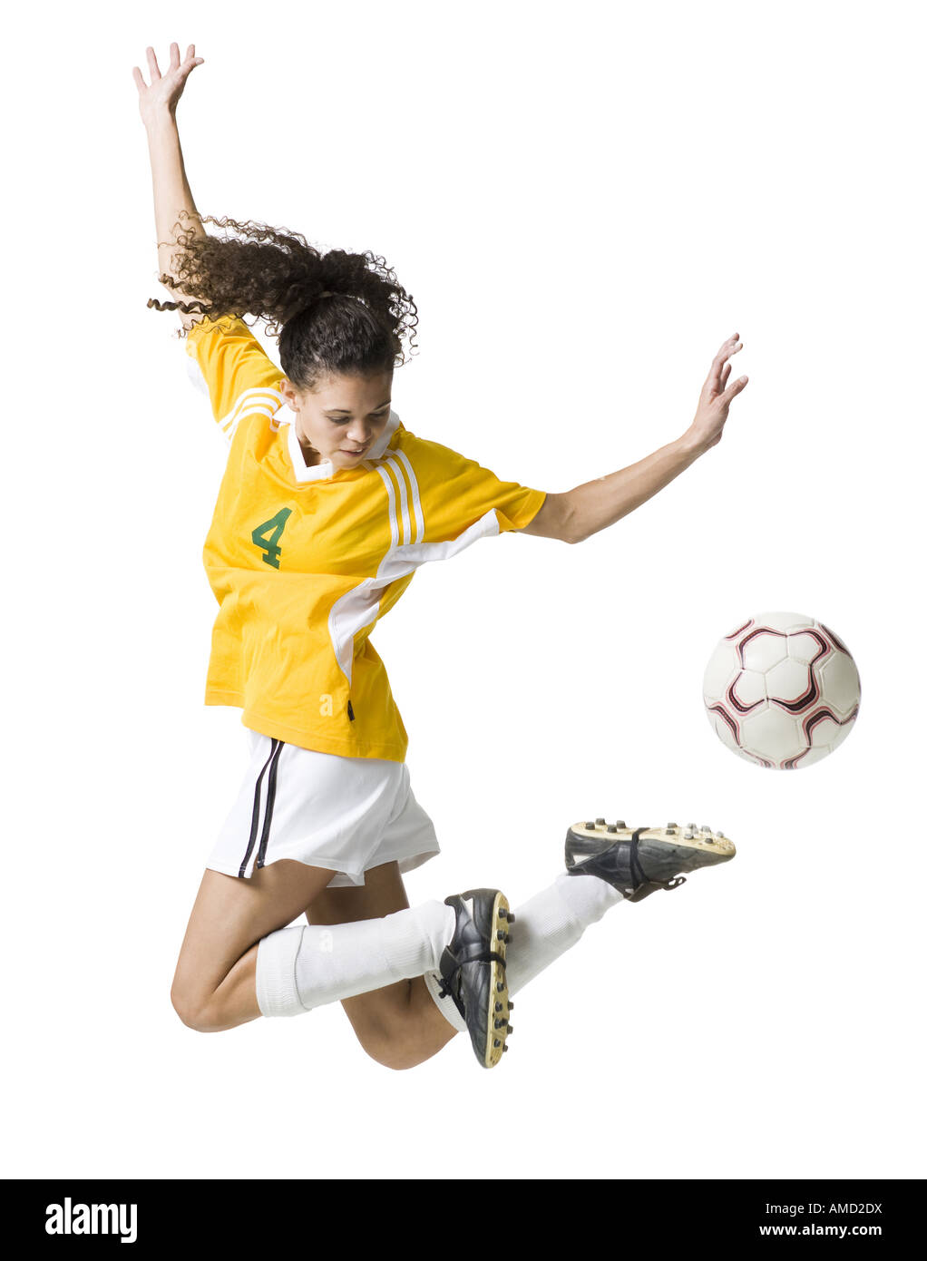 Teenage girl kicking soccer ball Stock Photo Alamy