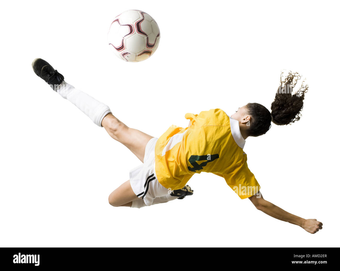 Teenage girl kicking soccer ball Stock Photo Alamy