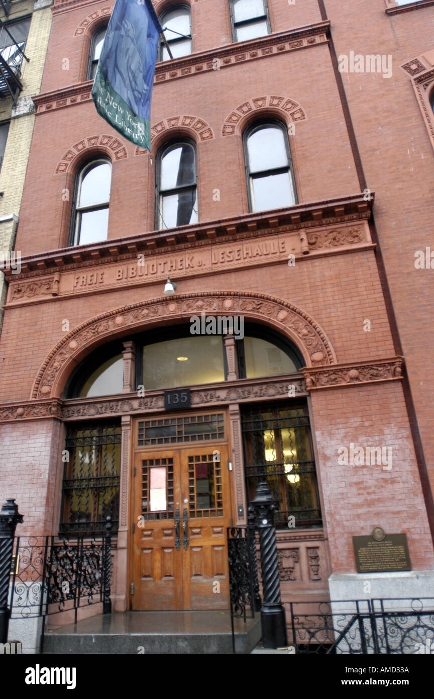 Front of brick library wooden double doors windows blue flag Angled ...
