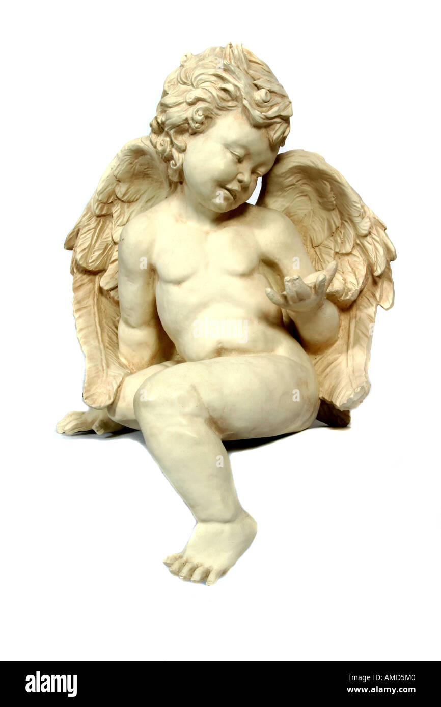 A statue of a winged cherub. Stock Photo