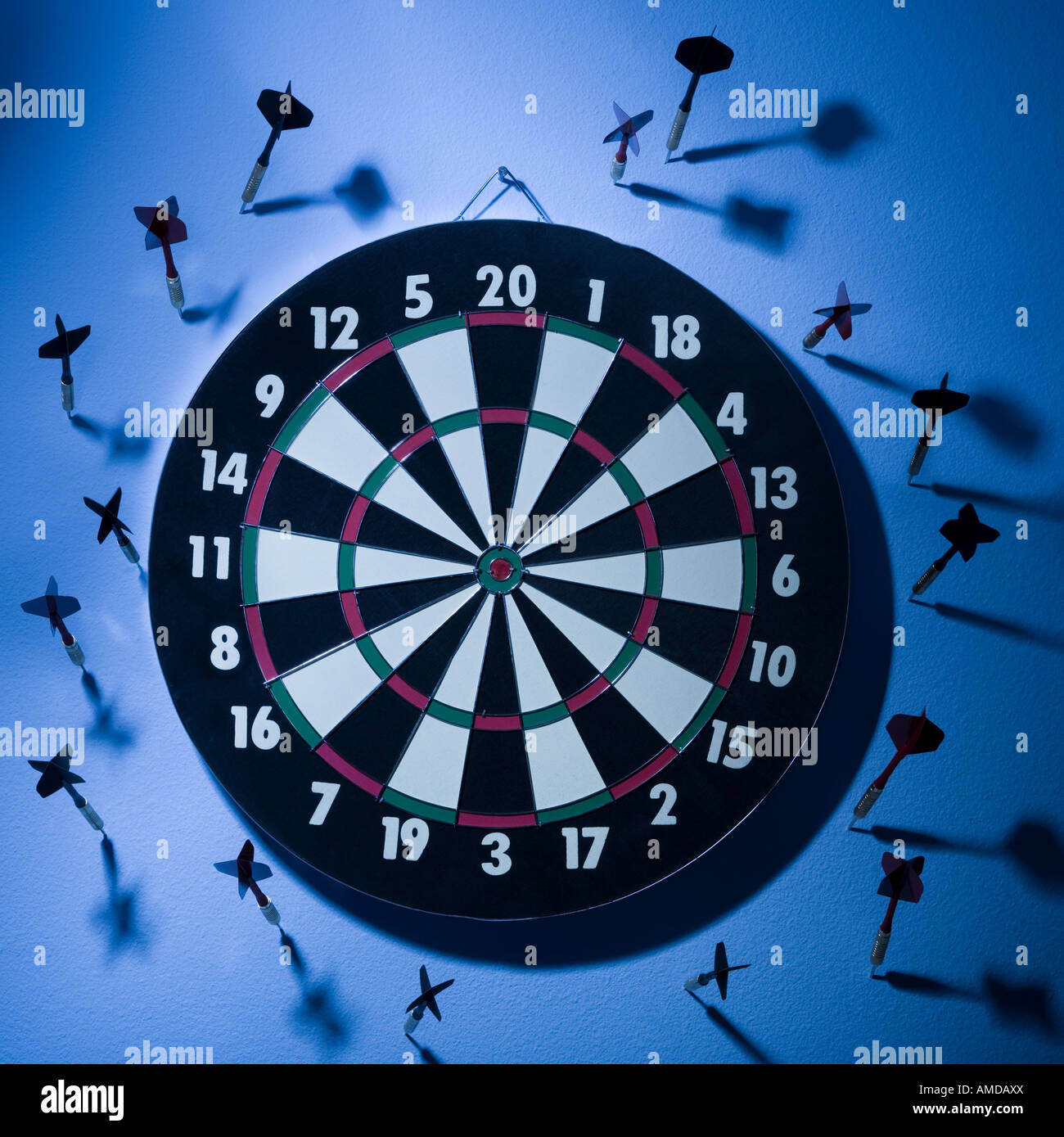 Dartboard with darts on wall Stock Photo Alamy