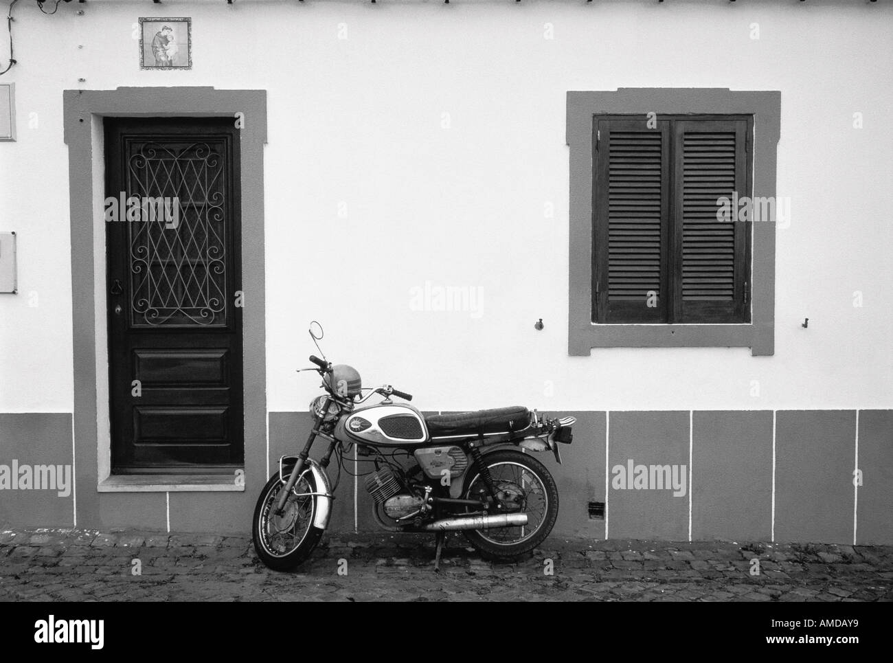 Motorcycle Parked near Door, Portugal Stock Photo