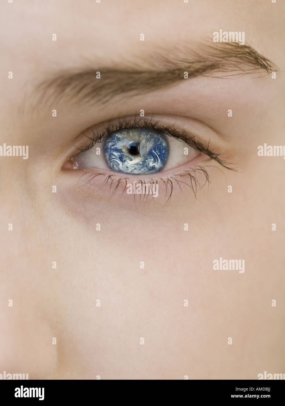 Close-up of woman's eye with earth reflection Stock Photo