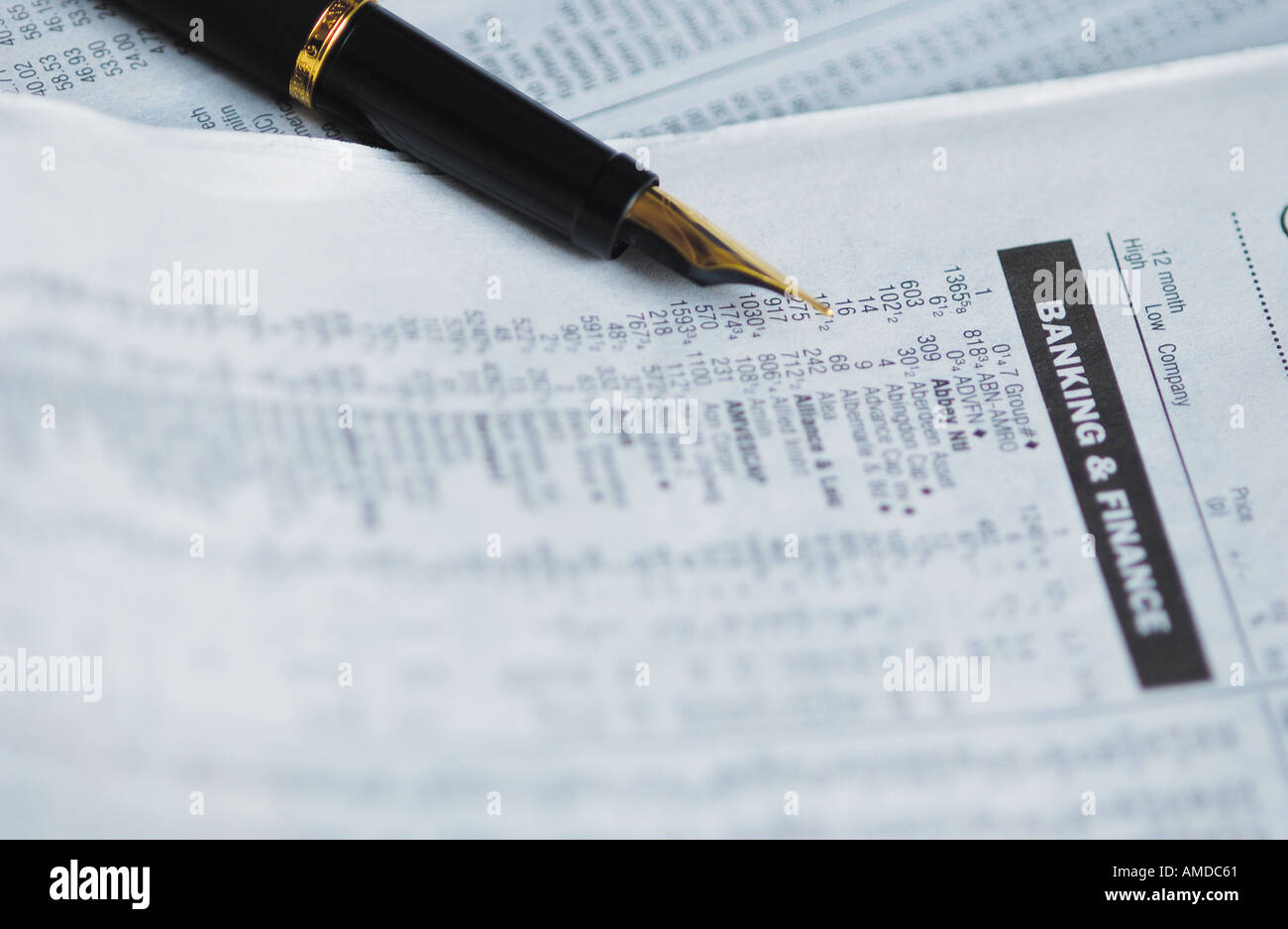 Business newspaper and fountain pen Close up Stock Photo