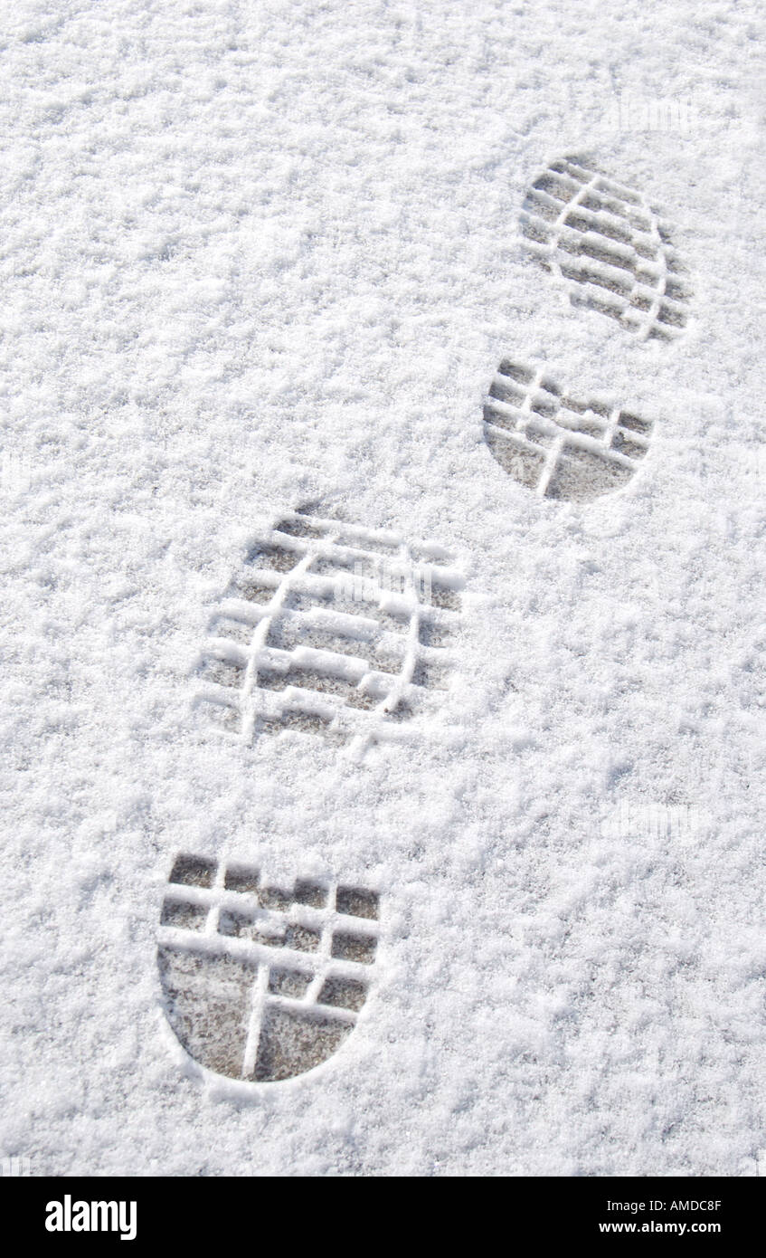 Close up of footprints Foot prints in the snow UK United Kingdom GB Great Britain Stock Photo