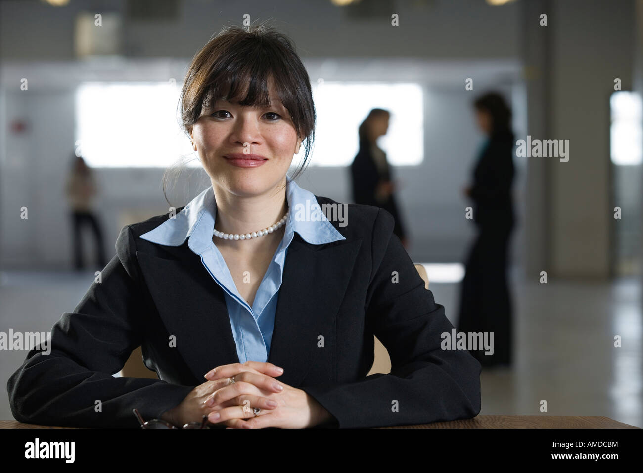 Portrait of business woman smiling Stock Photo - Alamy