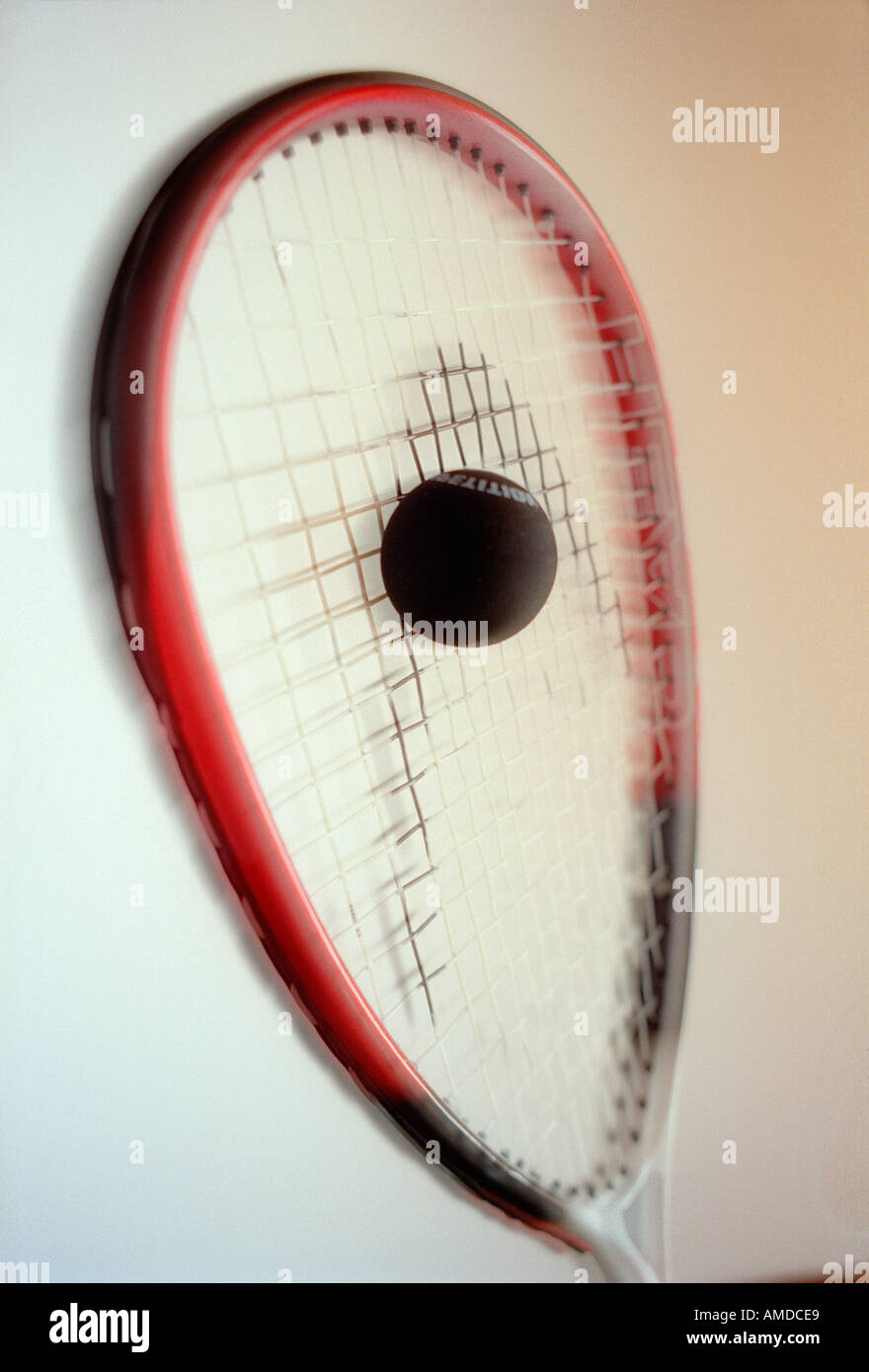 Squash racket striking a ball Stock Photo Alamy