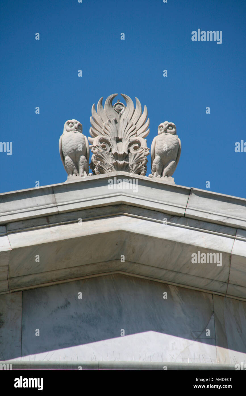 neoclassical architecture details decoration owls statues on the roof