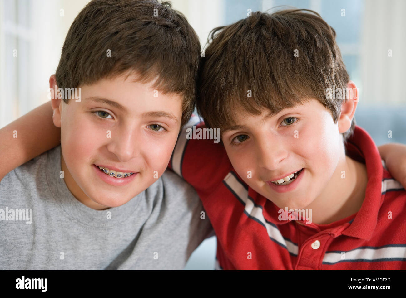 Portrait of two friends embracing each other. Stock Photo