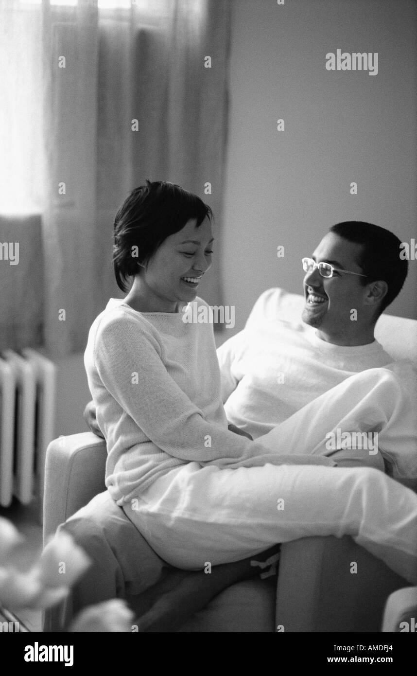 Couple Sitting in Chair, Talking Stock Photo