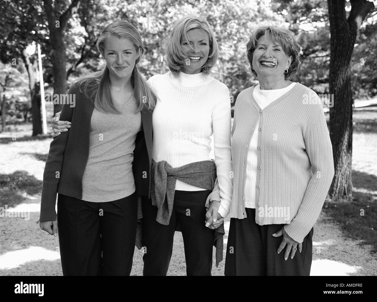 Portrait of Grandmother, Mother And Daughter Standing Outdoors Stock Photo