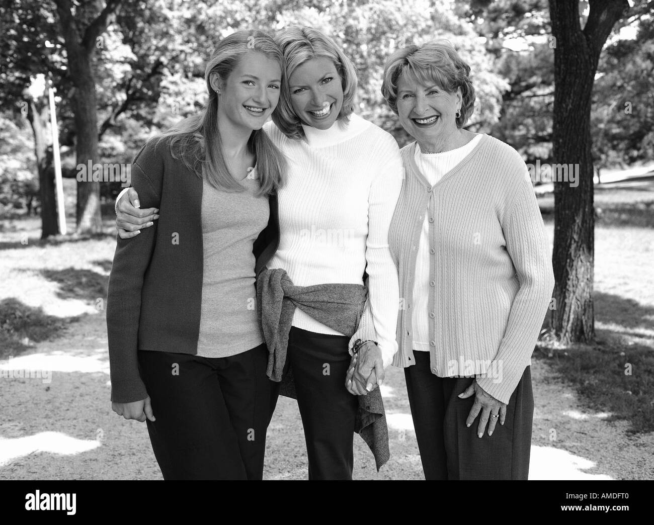 Portrait of Grandmother, Mother And Daughter Standing Outdoors Stock Photo