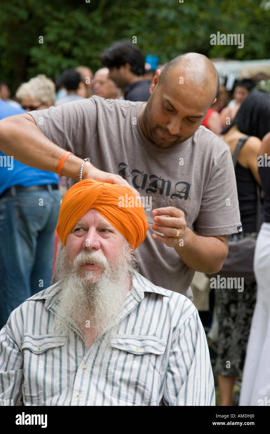 Turban demonstration at the Swindon Mela Stock Photo