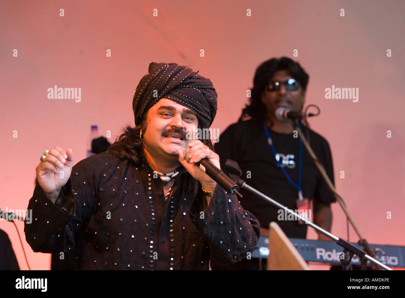 Artists on stage performing at the Swindon Mela Stock Photo Alamy