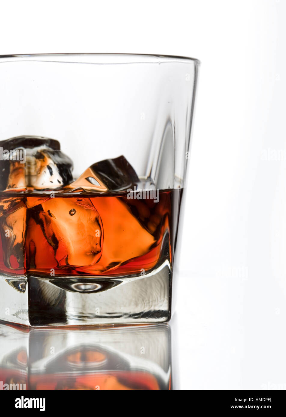 glass of bourbon whisky with ice on the rocks Stock Photo - Alamy