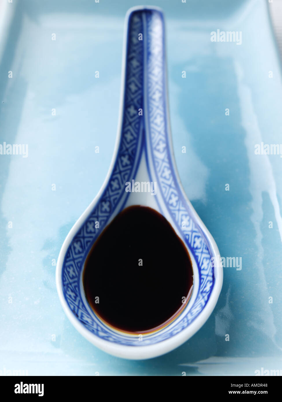 Soy Sauce in a Chinese rice spoon Stock Photo - Alamy