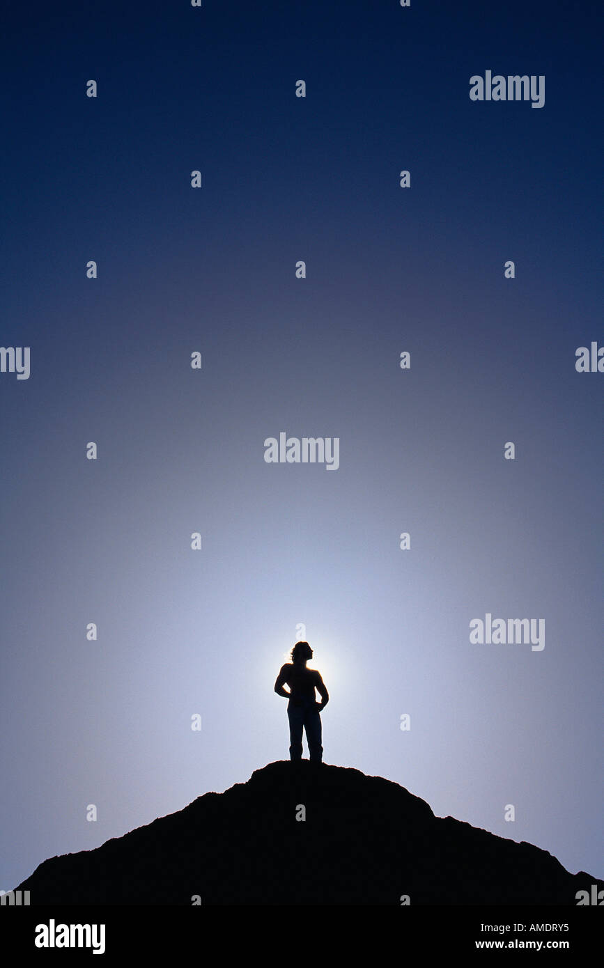 Silhouette of Man Standing on Mountain Top Stock Photo - Alamy