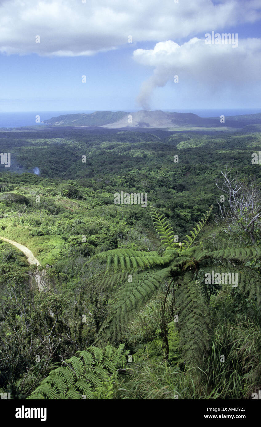 Mount Yasur volcano erupting and lowland forest Tanna Vanuatu Stock Photo