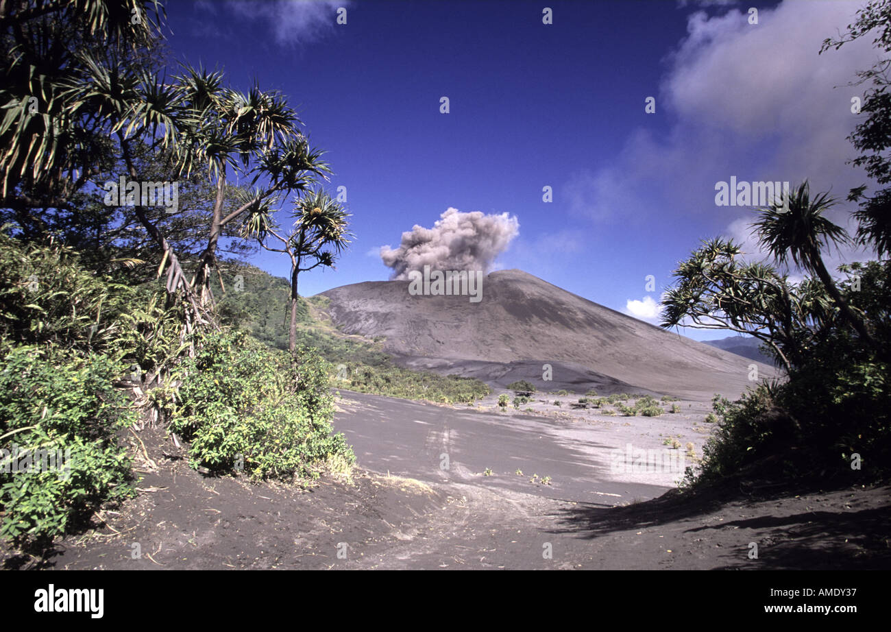 Mount Yasur volcano erupting and lowland forest Tanna Vanuatu Stock Photo