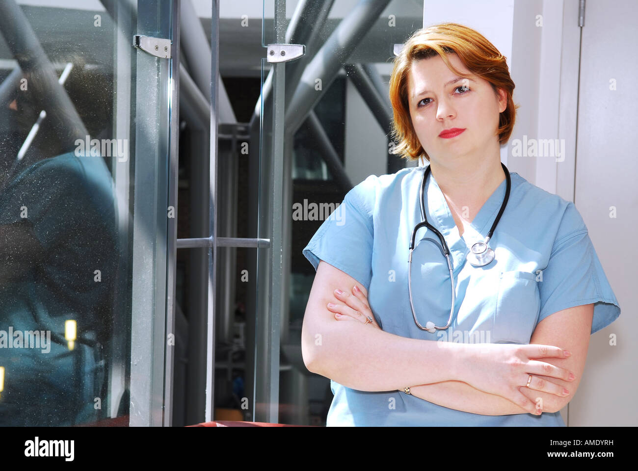 Woman in blue medical scrubs hi-res stock photography and images - Alamy