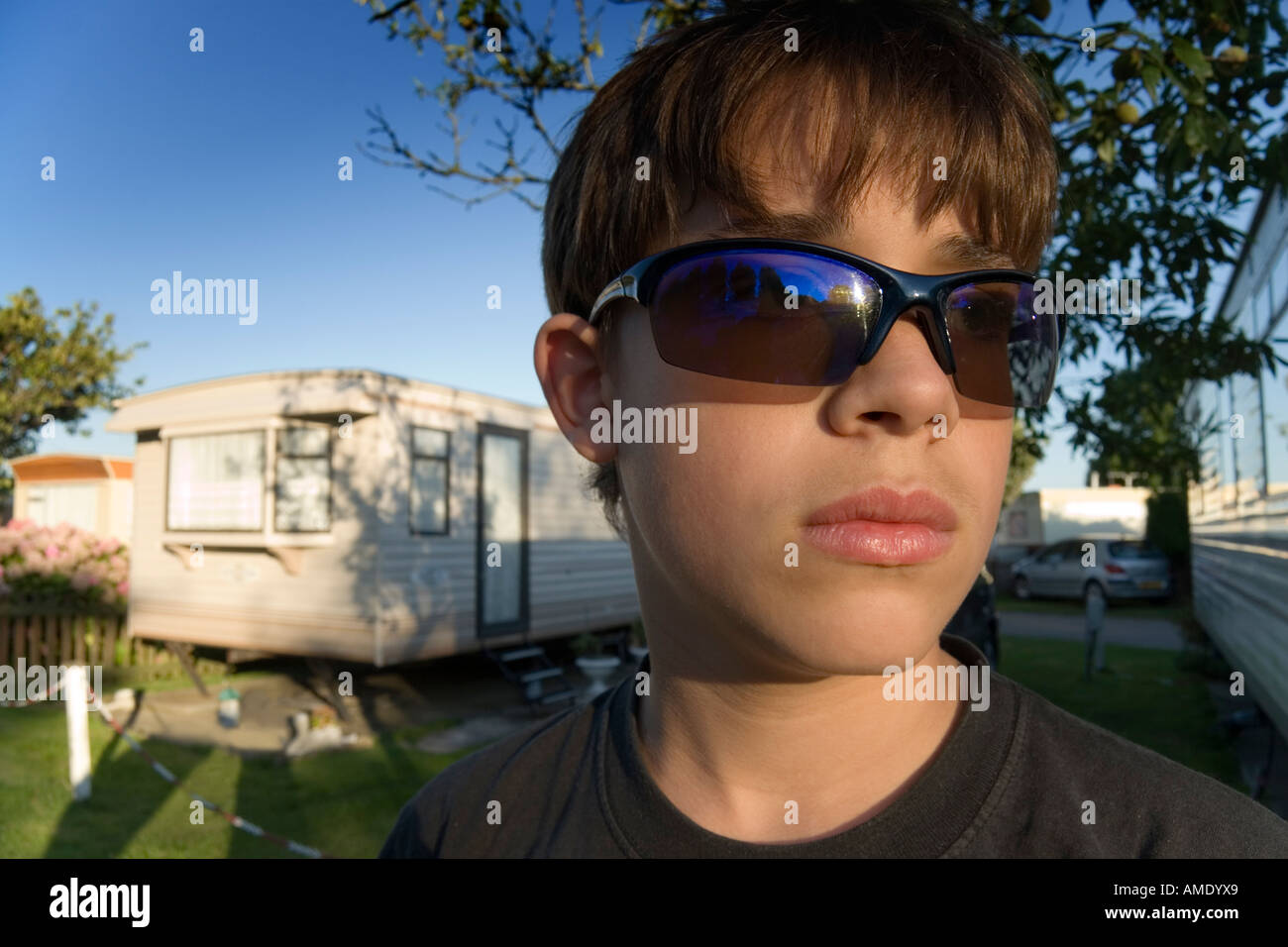 Teenage boy wearing sunglasses in hi-res stock photography and