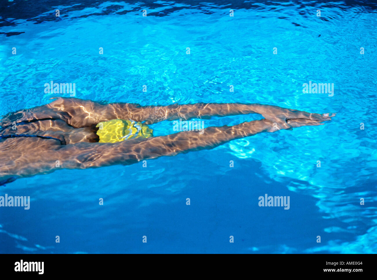 Woman Swimming in Pool Stock Photo