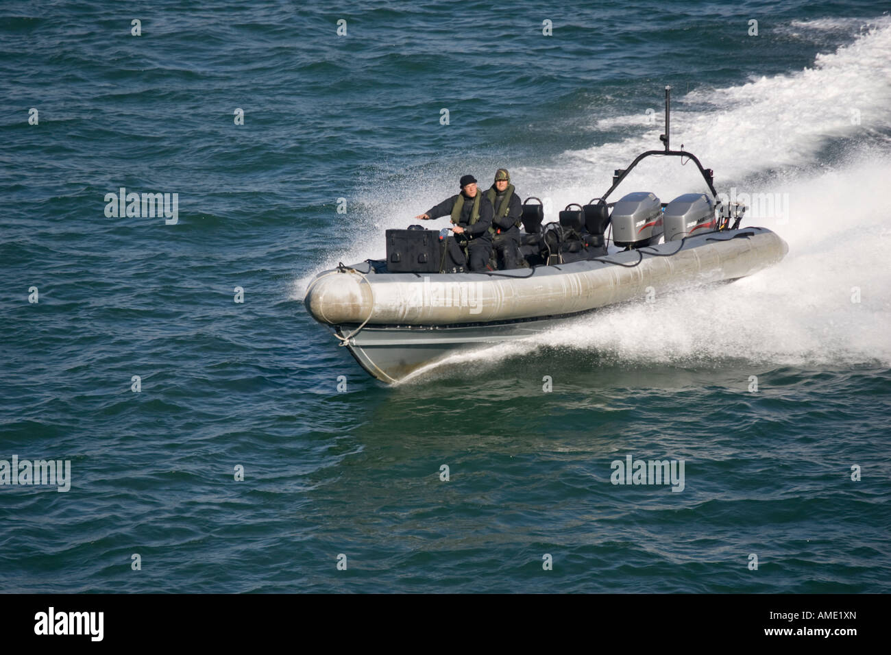Special forces military high speed inflatable training craft with twin outboard motors Poole Harbour Dorset UK Stock Photo