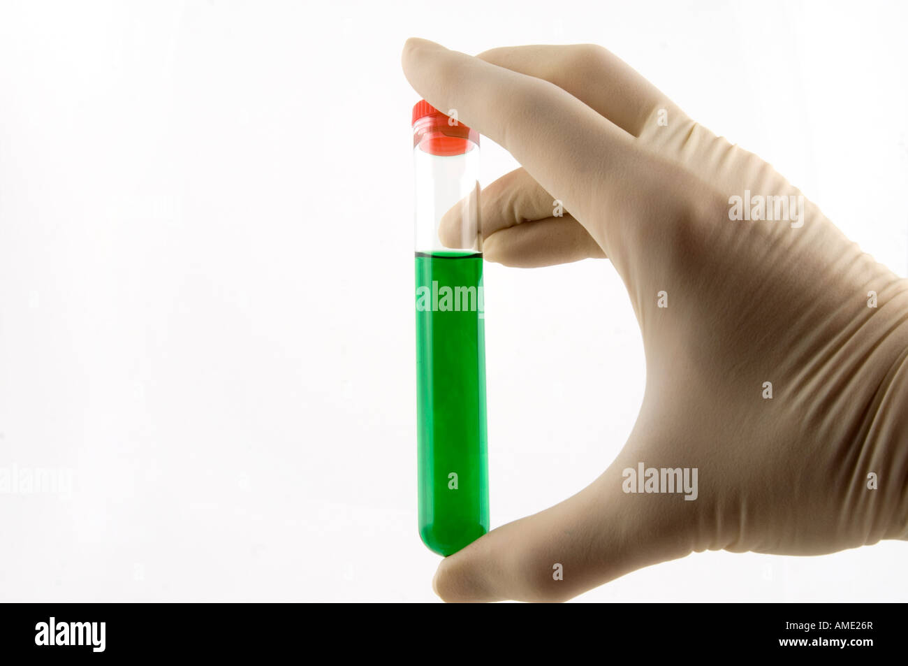 hand holding a test tube with green liquid Stock Photo - Alamy