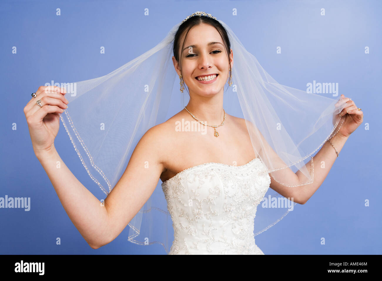 Portrait of young woman wearing wedding gown. Stock Photo