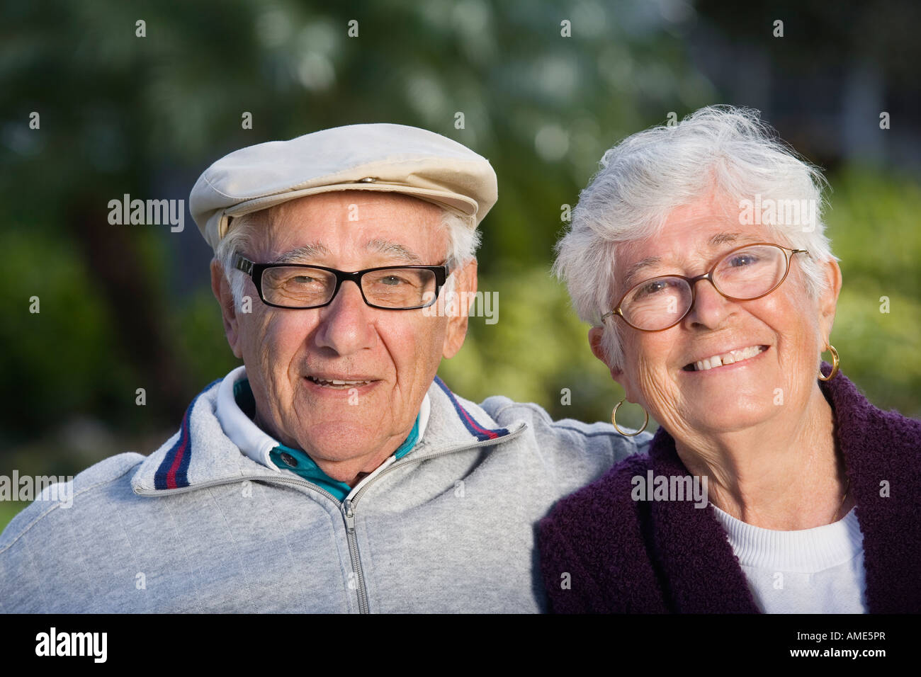 Portrait of a senior couple in a park Stock Photo - Alamy