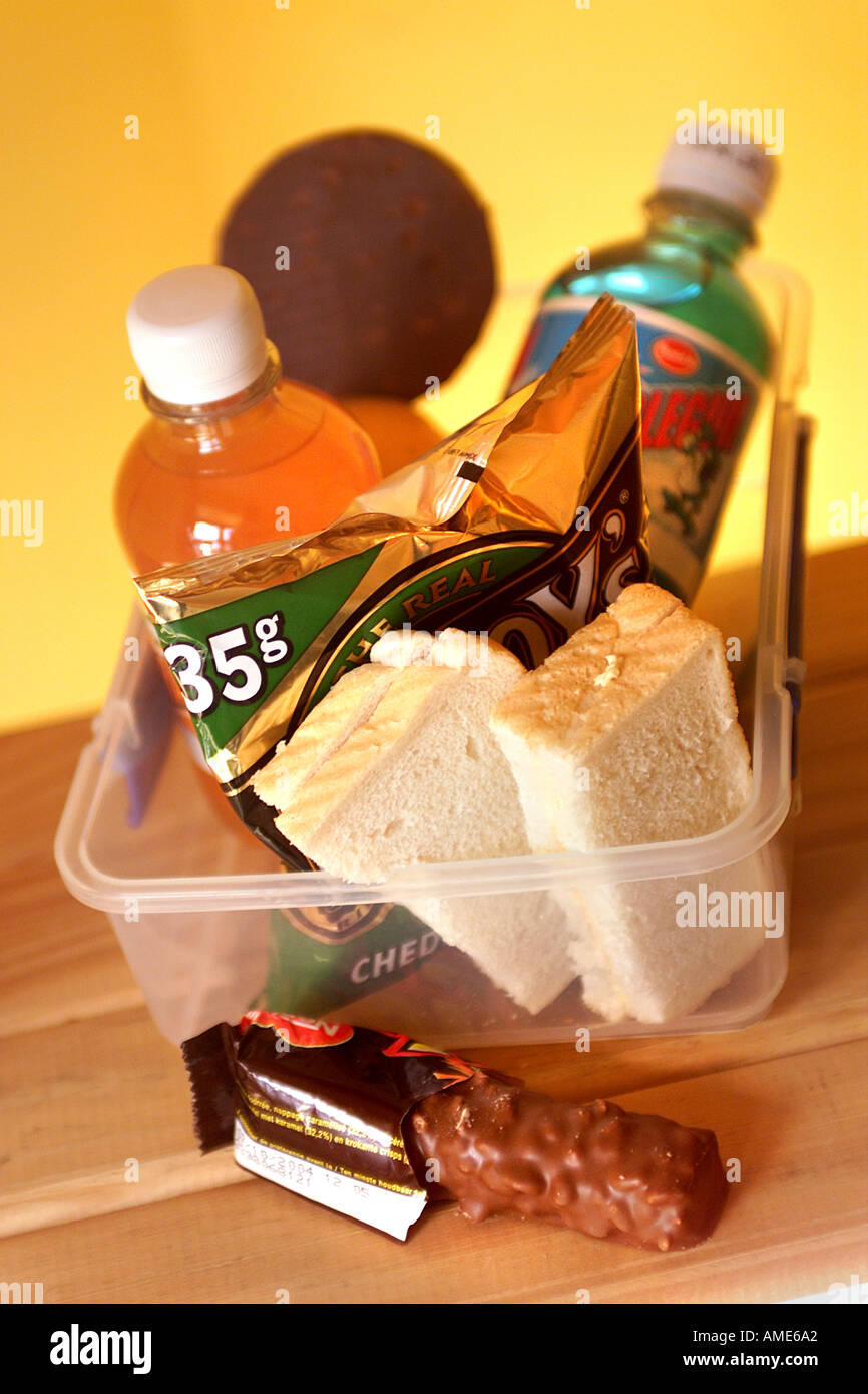 generic lunch box with sandwich chocolate soda fizzy drink biscuits crisps chips Stock Photo Alamy