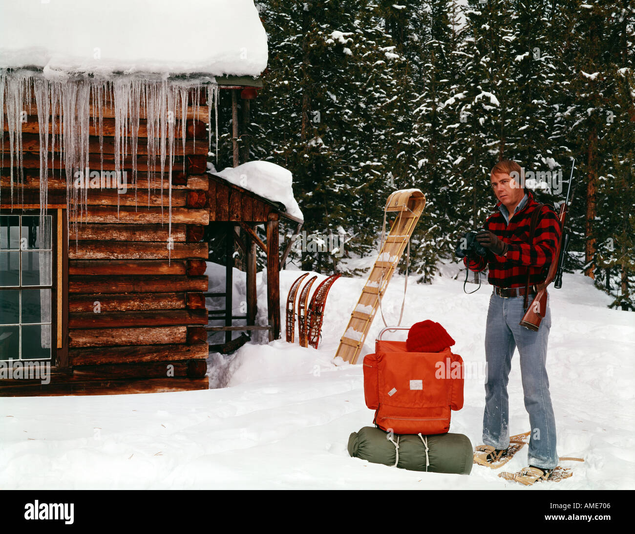 Winter Hunter Packing Up His Gear At His Log Cabin And Preparing