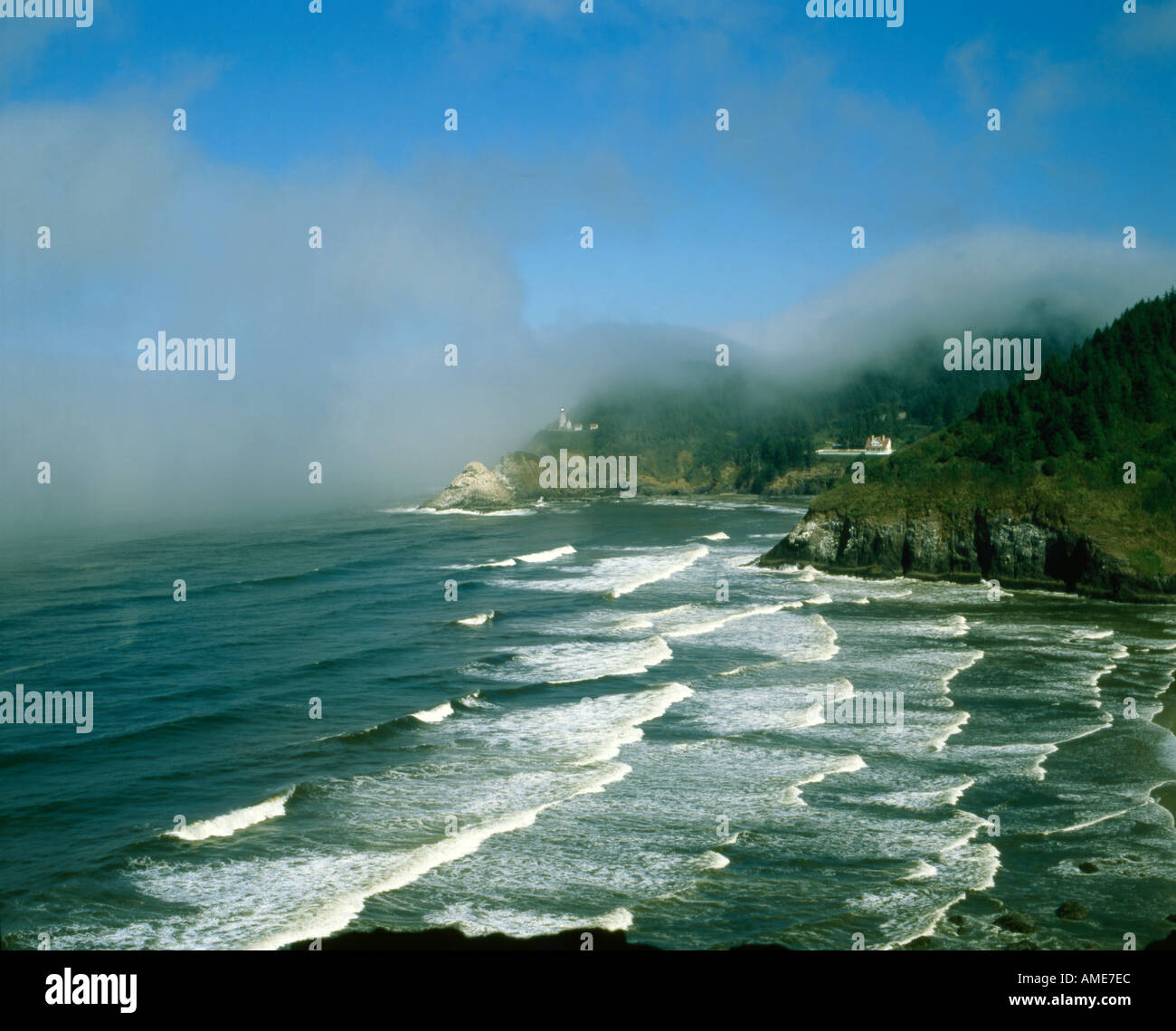 Fog moves in on Heceta Head Lighthouse at Devils Elbow State Park on the rugged and rocky Oregon coastline Stock Photo