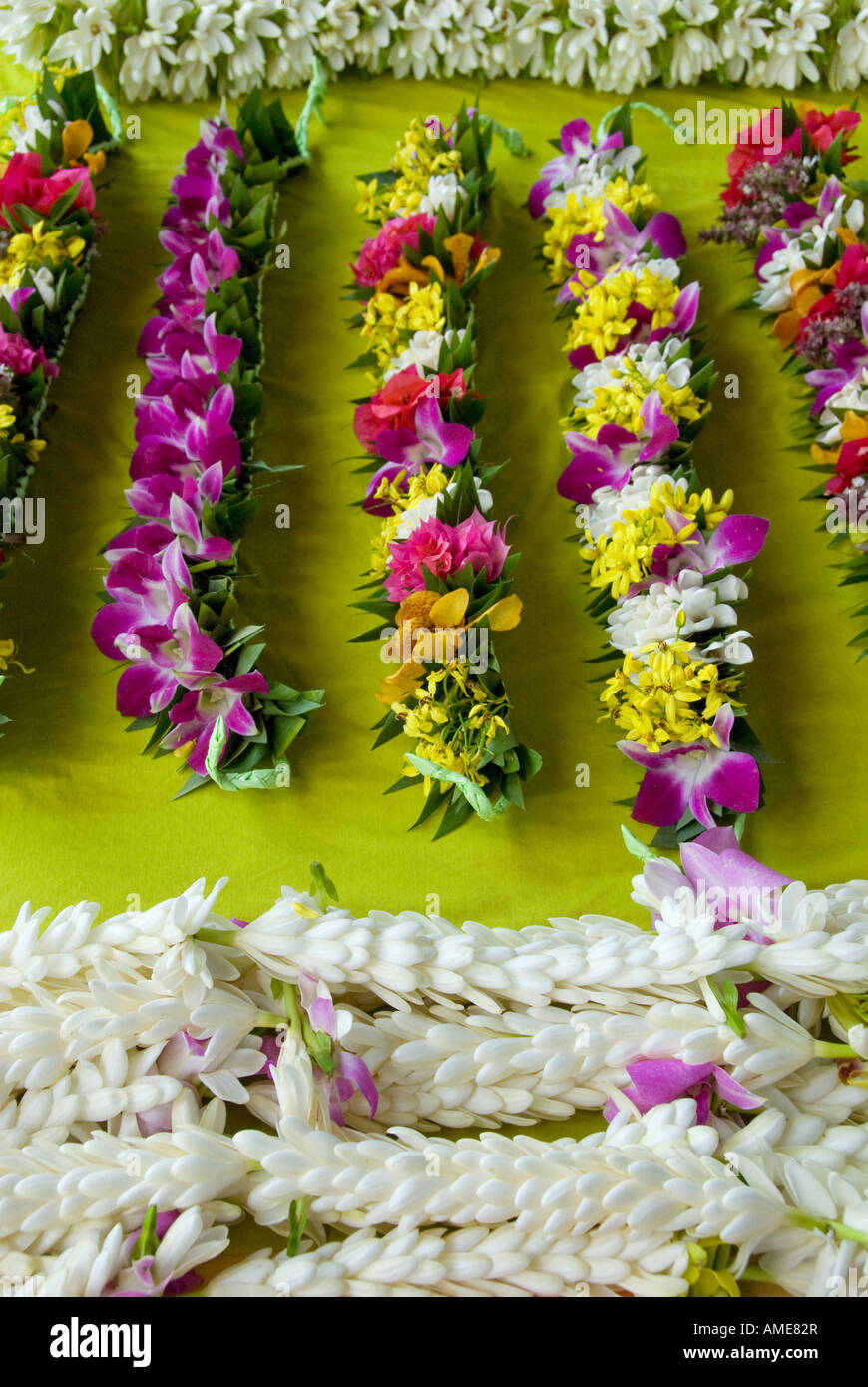 Tahiti, French Polynesia. Flower necklaces and crowns on display near