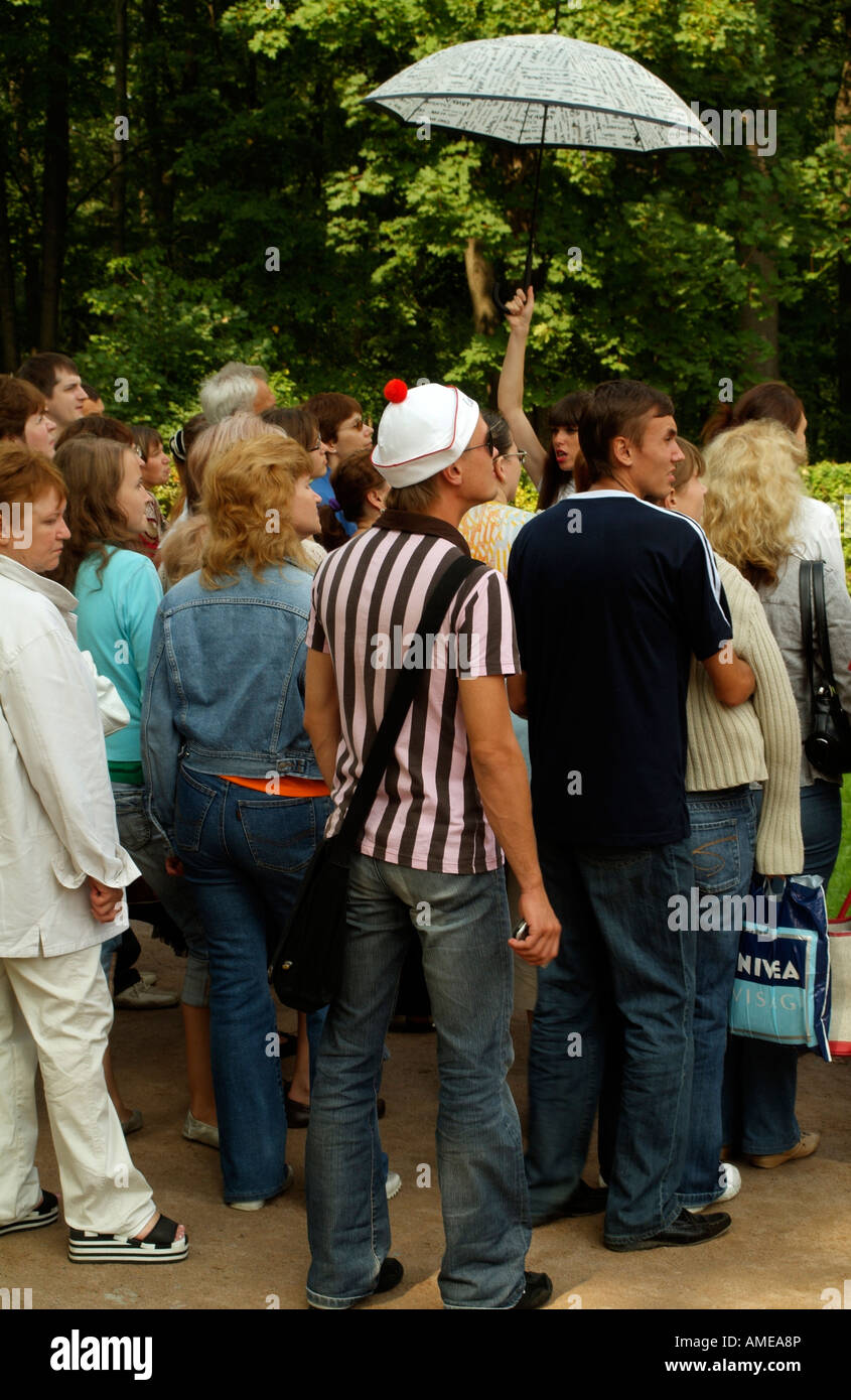 Tourists Group and Tour Guide Holding Umbrella Stock Photo Alamy