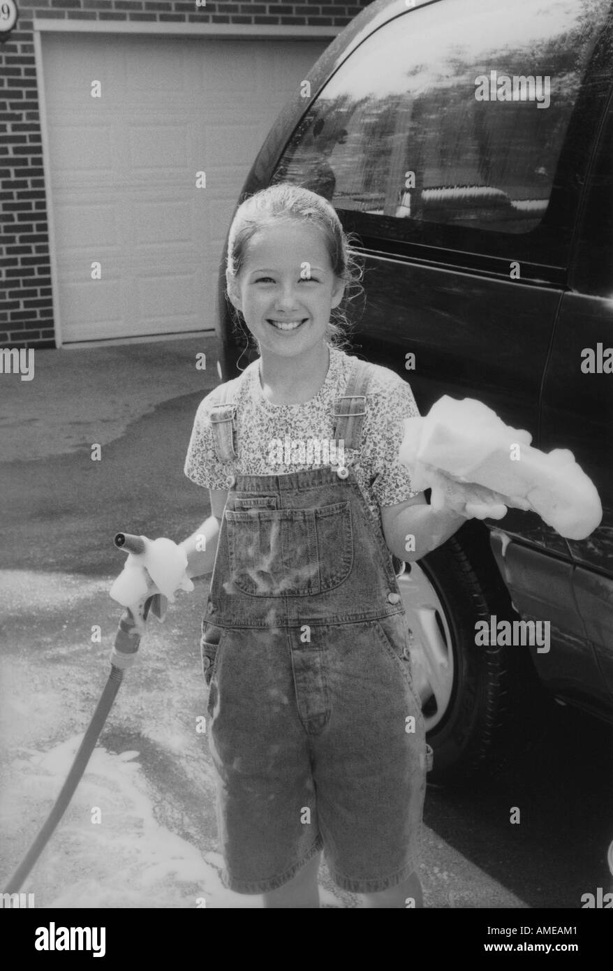 Portrait of Girl Washing Minivan Stock Photo