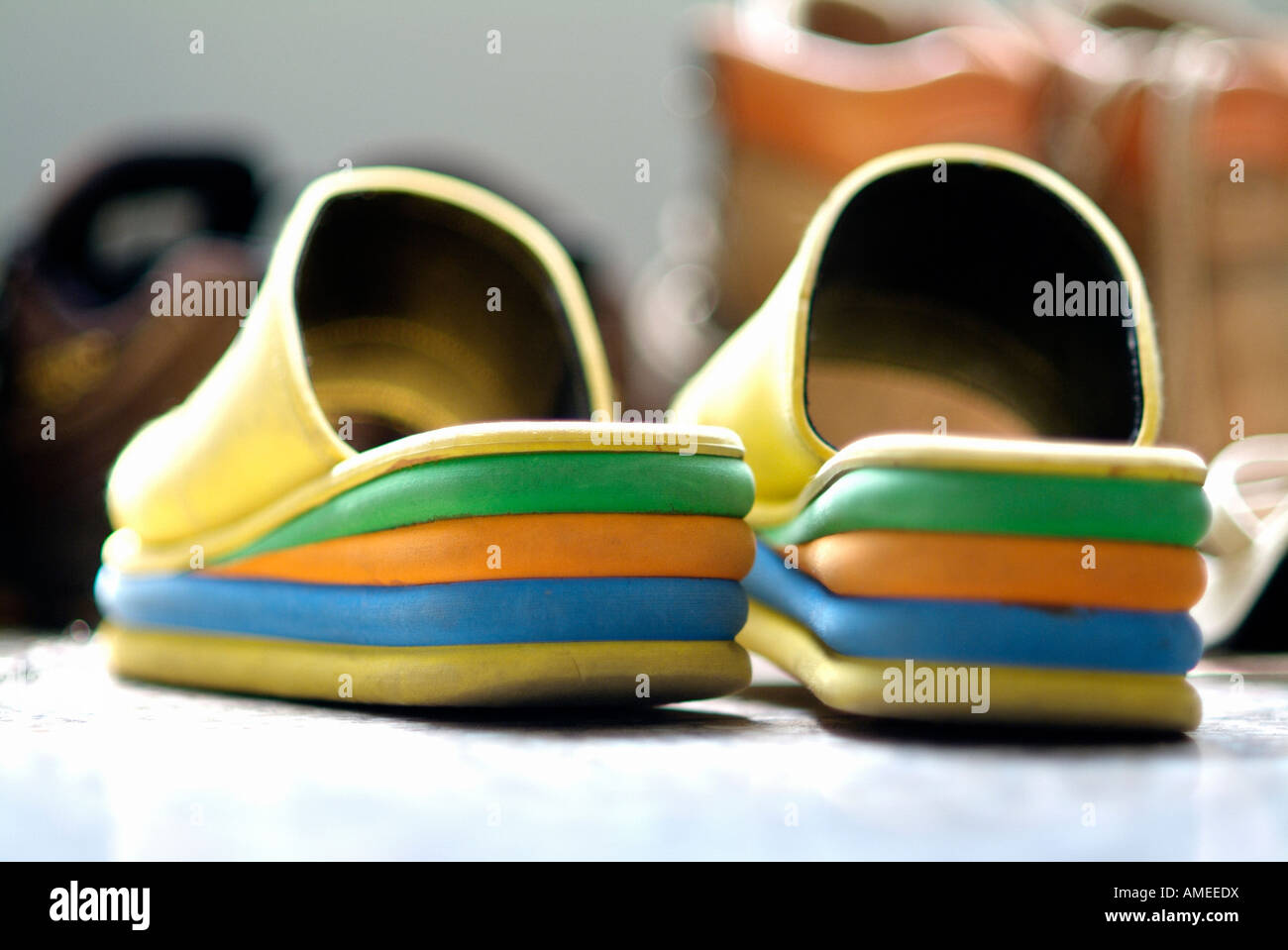 Funny colourful sandals in a dressing room Stock Photo - Alamy