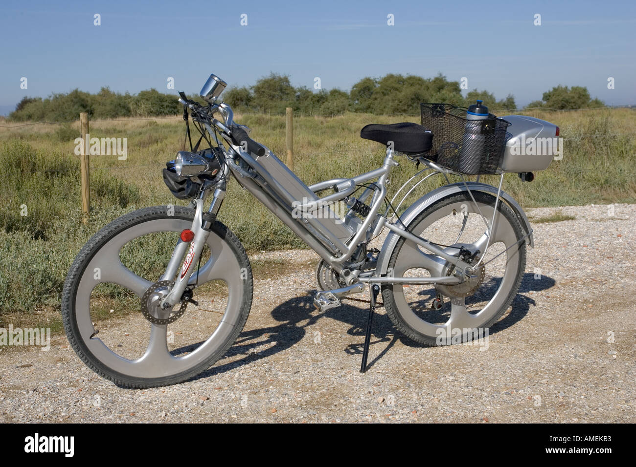 Modern electric bicycle with strong lightweight frame solid wheels disk brakes and special luggage carriers France Stock Photo