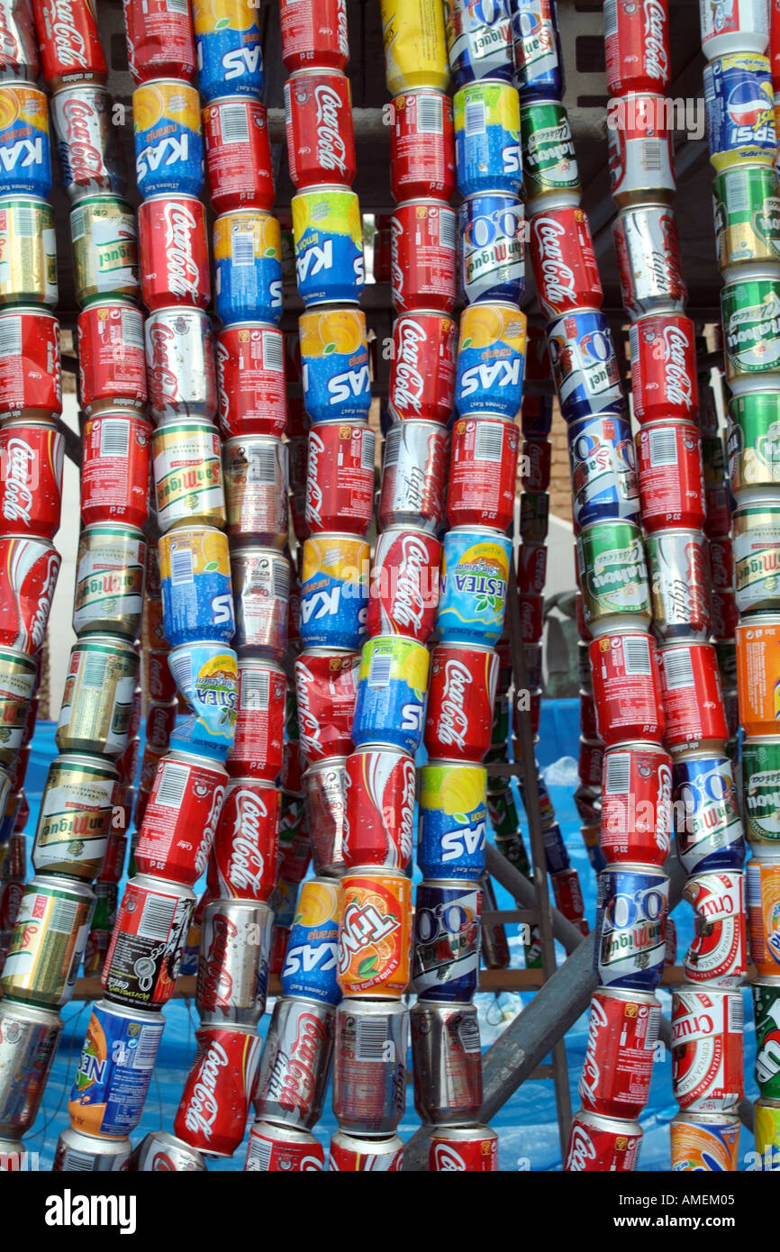 strings of cola drink and food metal cans containers for recycling tins ...