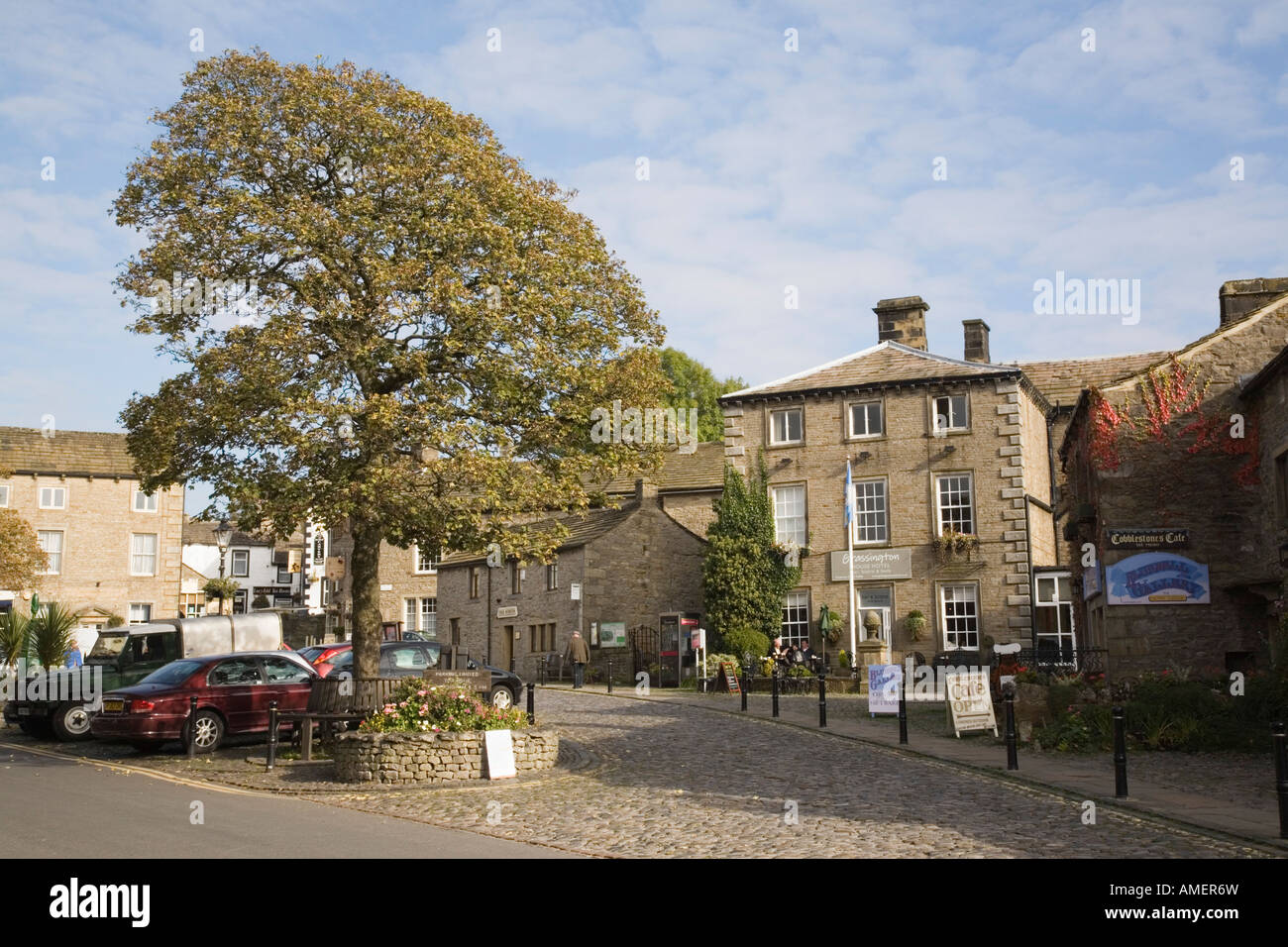 Traditional old stone building in village square in Yorkshire Dales National Park, Grassington Yorkshire England UK Stock Photo